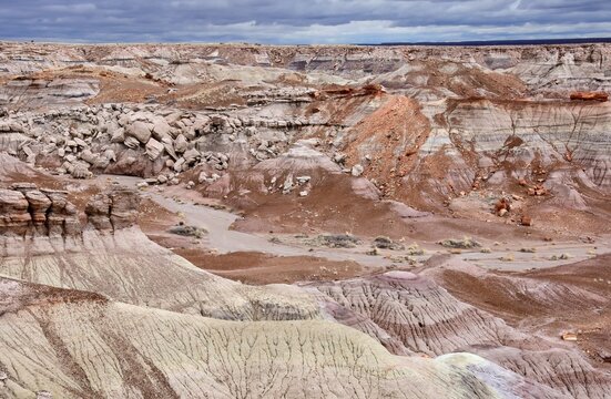 looking out over the colorful blue mesa  badlands area of petrified forest national park, arizona, on a stormy winter day