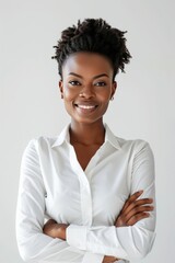Portrait of handsome smiling 40 year old black female business woman with folded arms  