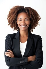 Portrait of handsome smiling 40 year old black female business woman with folded arms  