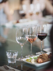 empty glass on dining table set - selective focus point. Table in the restaurant, served for wine tasting. Luxury Table setting.