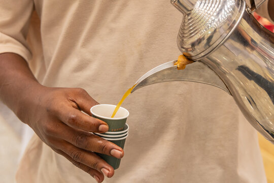 Pouring tea at a market in Buraydah.