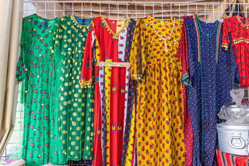 Women's dresses at a market in Unaizah.
