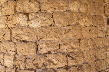 Detail of a weathered stone wall.