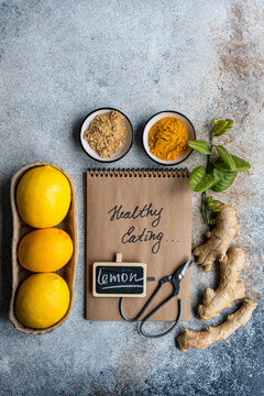 Cooking diary and fresh ingredients on kitchen table