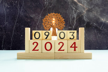 9 Marz on wooden grey cubes. Calendar cube date 09 March. Concept of date. Copy space for text or...