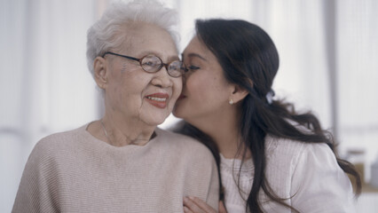 daughter showing love to mom