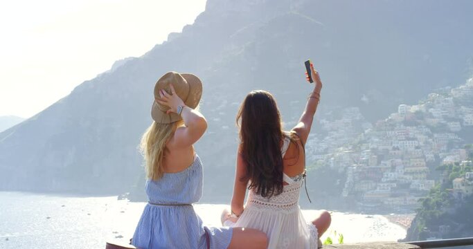Friends, celebrate and selfie with a cellphone together on a vacation in Italy for enjoyment. Tourists, getaway and social media in break from work, photography in the sun and freedom and summer
