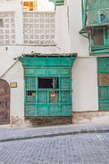 Traditional Hijazi tower house with wooden Rosan windows and balconies.