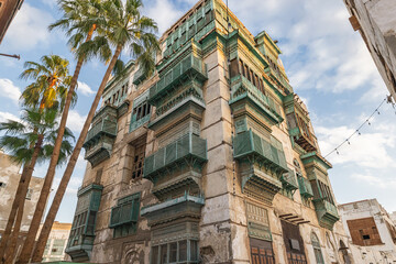 Traditional Hijazi tower house with wooden Rosan windows and balconies.