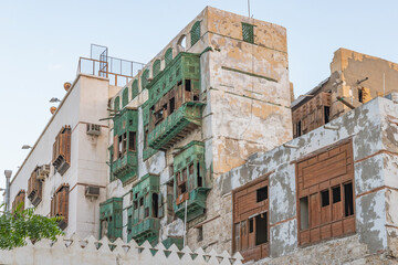 Fototapeta na wymiar Traditional Hijazi tower house with wooden Rosan windows and balconies.