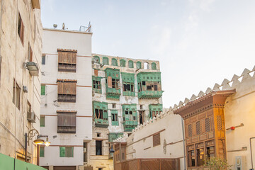 Traditional Hijazi tower house with wooden Rosan windows and balconies.