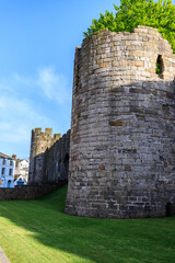 Fototapeta na wymiar Majestic Caernarfon Castle, UNSECO, Basking in the Golden Sunlight