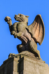 Majestic Stone Dragon Basking Under the Clear Blue Sky
