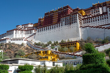 Once home to the Dalai Lama, Potala Palace is a popular tourist attraction in Lhasa. - obrazy, fototapety, plakaty