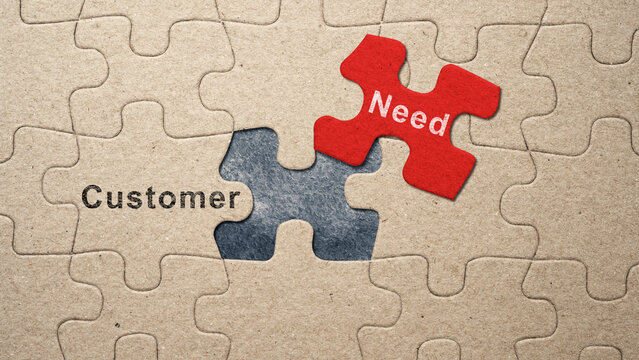 Piece of missing jigsaw puzzle with customer needs text