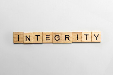 The row of wooden cubes with integrity text