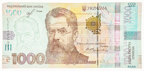 New banknote denomination of 1000 UAH. 1000 Hryven Banknote closeup. 1000 Ukrainian Hryvnia banknote on white background. 1000 uah watermark. Fragment of Ukrainian banknotes.
