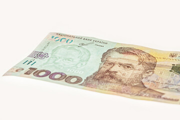 New banknote denomination of 1000 UAH. 1000 Hryven Banknote closeup. 1000 Ukrainian Hryvnia banknote on white background. 1000 uah watermark. Fragment of Ukrainian banknotes.