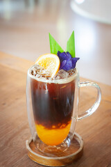 Iced coffee mix with passion fruit juice. Summer fusion drink