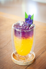 Iced coffee mix with passion fruit juice. Summer fusion drink