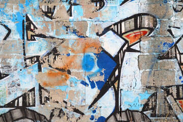 Colorful background of graffiti painting artwork with bright aerosol outlines on wall. Old school street art piece made with aerosol spray paint cans. Contemporary youth culture backdrop