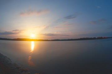 view of a lake at sunrise, golden hour, copy space