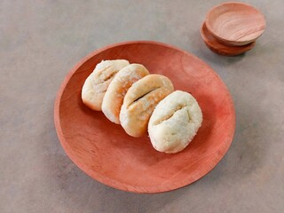 bread and butter. Cookies sprinkled with granulated sugar served on a wooden plate. bakpia. small...