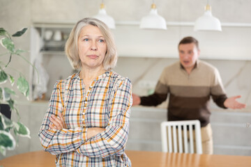 Family quarrel, son blaming mother, both are upset, angry and disappointed