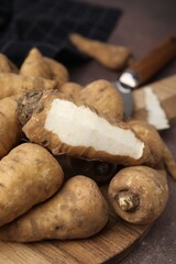 Tubers of turnip rooted chervil on table, closeup