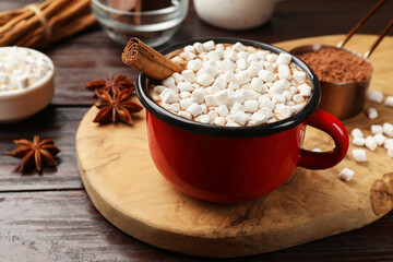 Tasty hot chocolate with marshmallows on wooden table, closeup