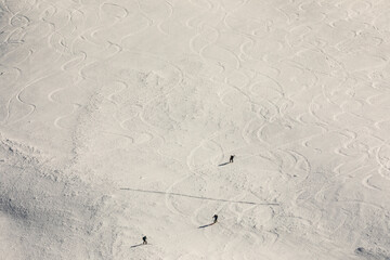 Individuals skiing in Alps