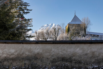 Church steeple with mountains in background