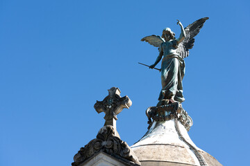 angel statue with trumpet in hand