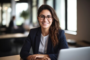 Portrait of a Smiling Female HR Officer in a Contemporary Office Environment - obrazy, fototapety, plakaty
