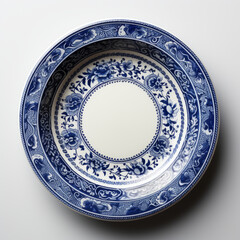 Fototapeta premium Vintage Blue and White Porcelain Plate on White Background