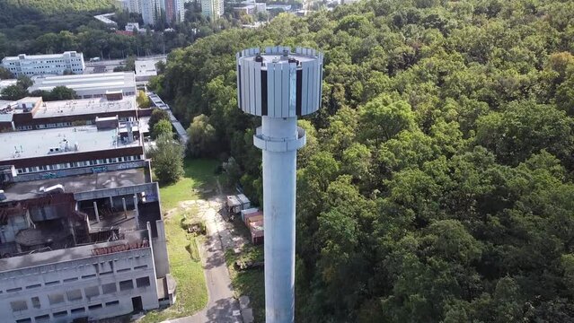 revealing shot city meteorological tower research center brutalist concrete water tower in forest
