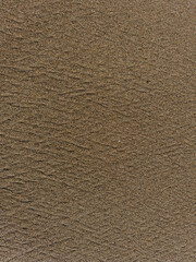 Texture of the sand on a beach in San Francisco after the tide pulls away, revealing a criss-crossing pattern and the beauty of natural geometry.