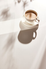 Natural texture of various glass cups on a table with
sunlight streaming in.