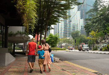 Fototapeta premium family walking in Kuala Lumpur city