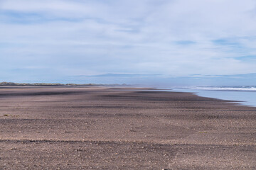 The massive black iron sand Karekare beach. Waitakere Ranges Regional Park, Auckland, New Zealand.