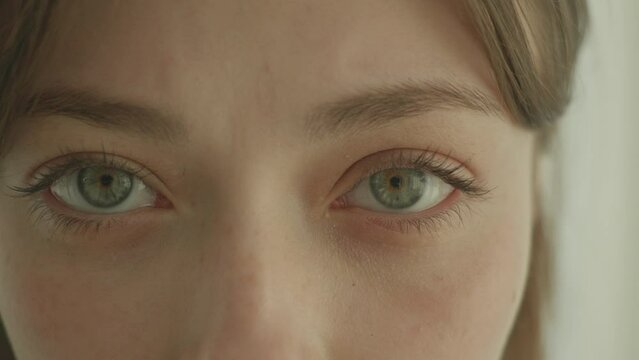 close up of woman's green/blue eyes. Contact lenses