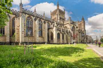 Fototapeta na wymiar Bristol Cathedral, the Cathedral Church of the Holy and Undivided Trinity, on a a sunny spring morning in No Mow May .