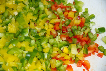 Salad of finely chopped red and yellow green peppers