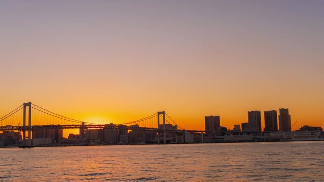 Time lapse of Tokyo bay with Rainbow Bridge, from sunset through to twilight shot