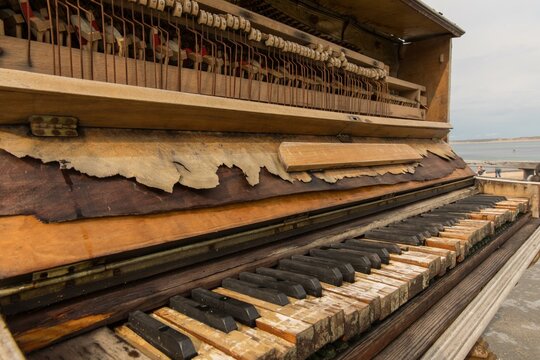 Weathered piano on the beach promenade in Kliltmoller, Thy region, Jutland, Denmark, Europe