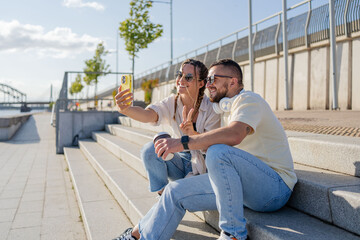 couple in the city to relax, smile and be happy together in summer. Portrait of an urban and interracial man and woman. Smile, happy guy and woman or student fashion friends.
