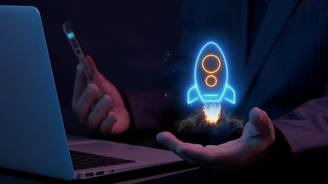 Businessman working with his laptop and showing hologram of dollar sign and rocket spaceship icon. Money, profit, investment, startup, growth business, economy, financial and successful concept.