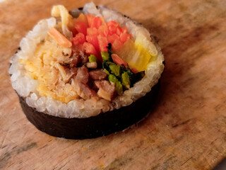 kimbap close-up. Korean style nori roll with yakiniku inside.