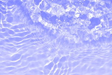 Water surface. Purple water waves on the surface ripples blurred. Defocus blurred transparent blue...