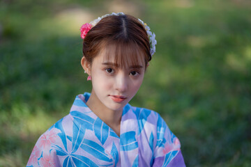 Pretty girl in a Yukata dress.  A young Asian woman wearing a traditional Japanese kimono or Yukata...